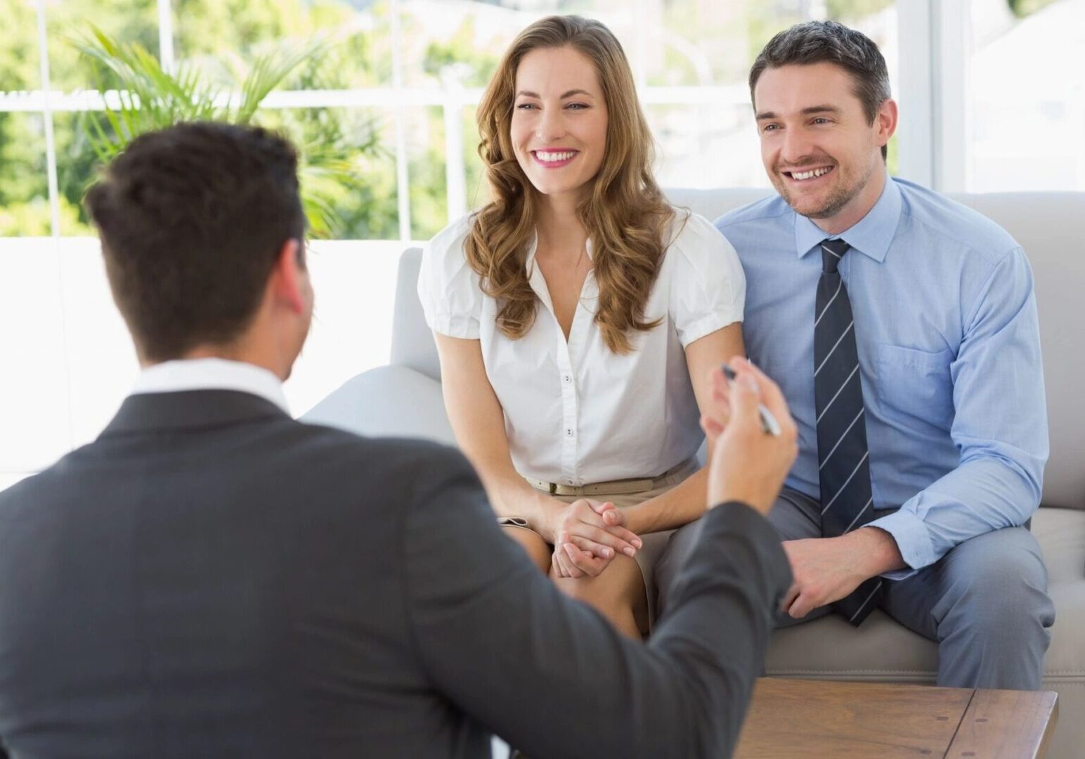 An agent talking to a couple